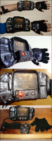 Pip Boy (Fallout 3). Paper mache, paint, pens, cloth. Working lights and dial designed and built by my partner.